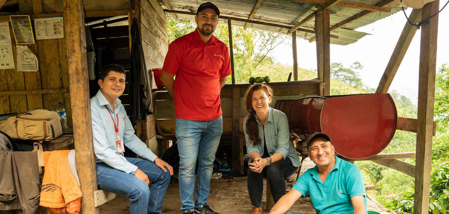 westrock employees sitting at an ethically sourced coffee farm